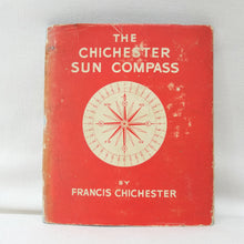 Vintage book titled 'The Chichester Sun Compass' by Francis Chichester, featuring a red cover with a cream-colored compass illustration and text.